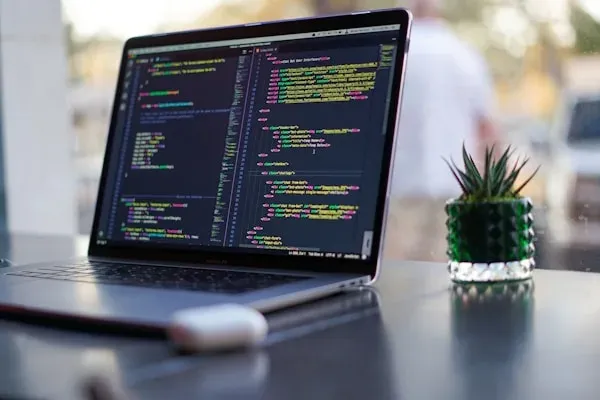 Laptop with code on table